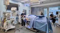 Simulation Center operating room with students practicing clinical skills.